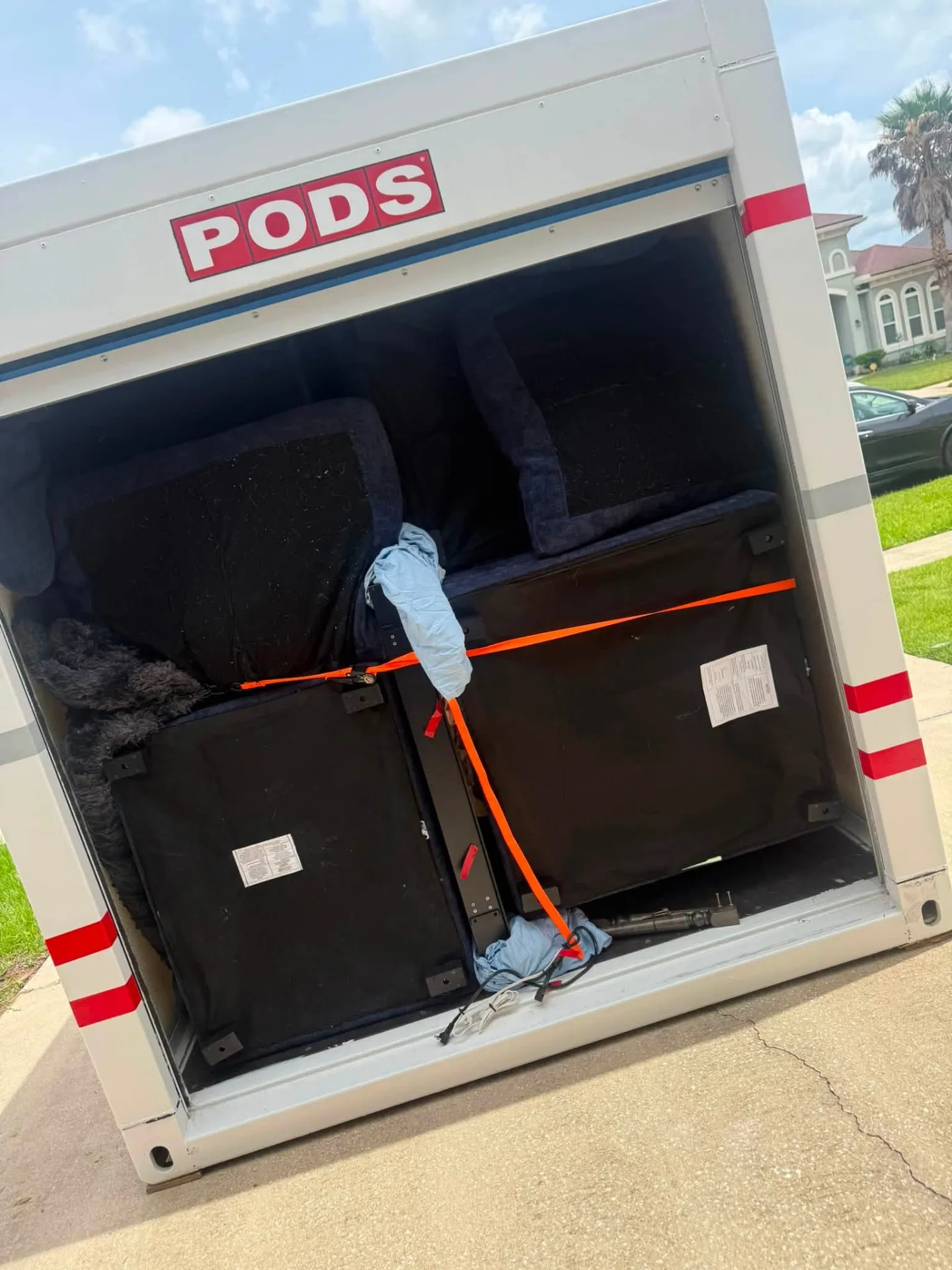 Furniture strapped down inside a PODS container